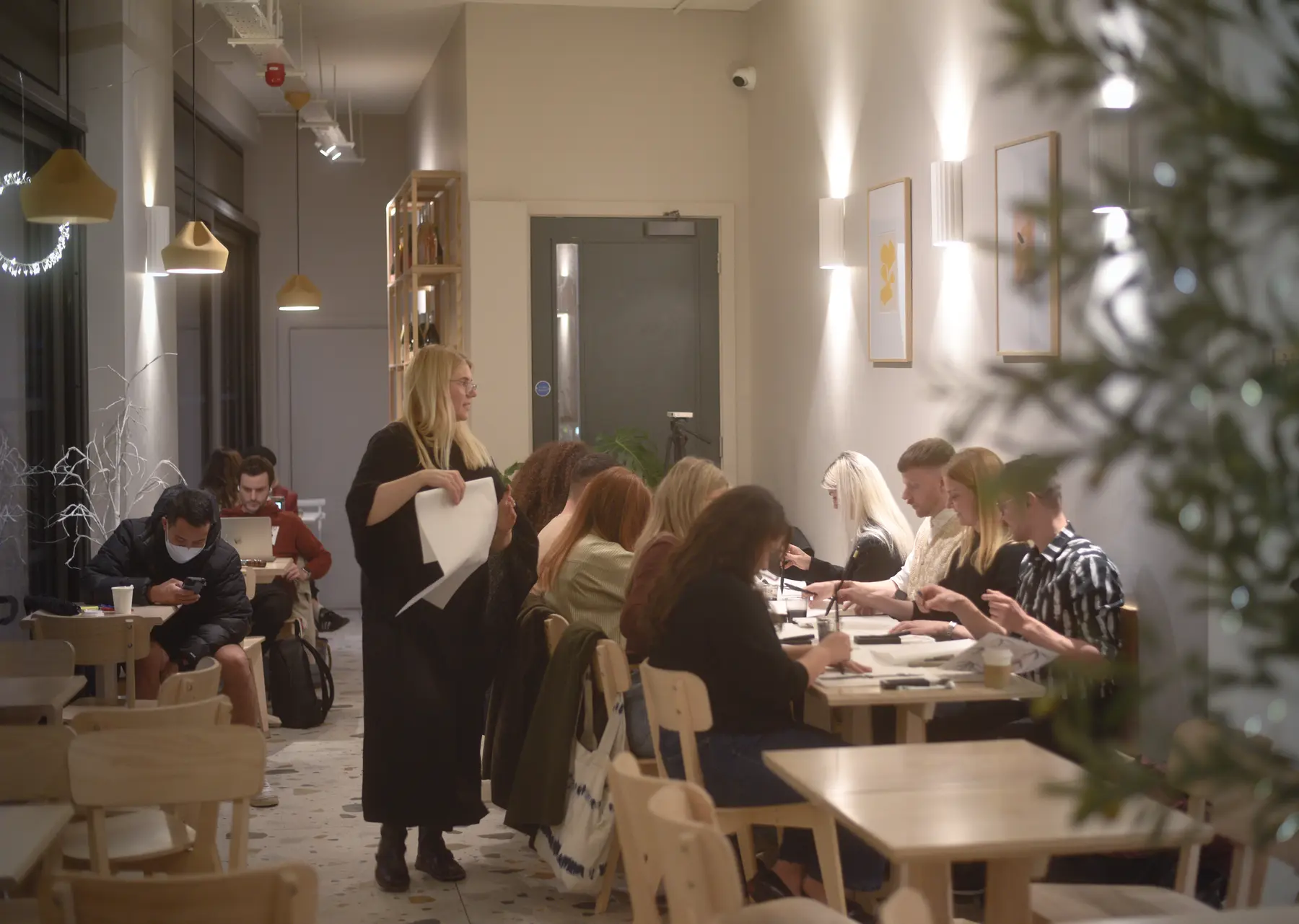BonBon participants concentrating together during an intimate Sumi-e workshop